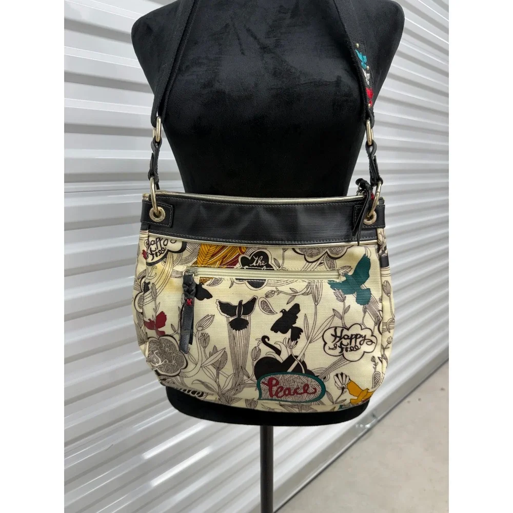 Sakroots Artist Circle Peace Print Bird Crossbody Bag Coated Canvas Cream Black